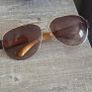 Lovely ELLE aviator sunglasses with brown tinted lenses, gold-tone metal frame and brown arms. Model EL18150, colour 719. Pre-owned condition, please see all photos for details. Image 2