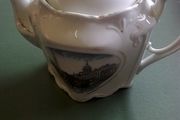 Old souvenir teapot with scene of Custom House Dublin.