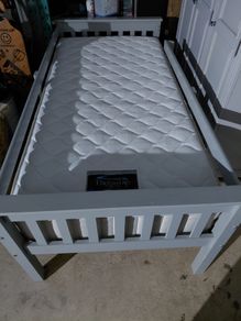 Grey single bed with sides and new mattress