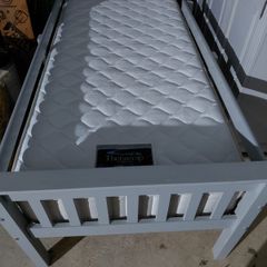 Grey single bed with sides and new mattress