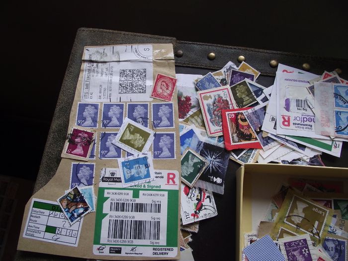 A box with collection of stamps from Great Britain