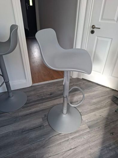 Two adjustable grey breakfast bar stools