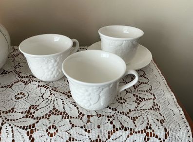 Three Wedgwood Strawberry and Vine cups and one saucer