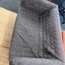 Grey quilted sofa with white metal frame Image 6