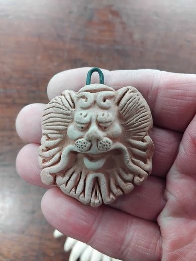 Two Terracotta Faces