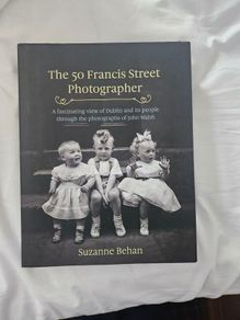 The 50 Francis Street Photographer. A Fascinating View Of Dublin And Its People Through The Photographs Of John Walsh. By Suzanne Behan. First Edition Large Volume Hardback With Dustjacket In Good Condition.  See Photos For Same.