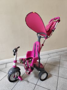 Pink toddler trike with parent handle and canopy