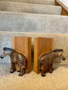 Early c20th hand-carved wooden zebra bookends