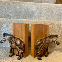 Early c20th hand-carved wooden zebra bookends