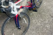 2 boys racing bikes. 1 adult ladies bike.