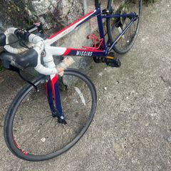 2 boys racing bikes. 1 adult ladies bike.