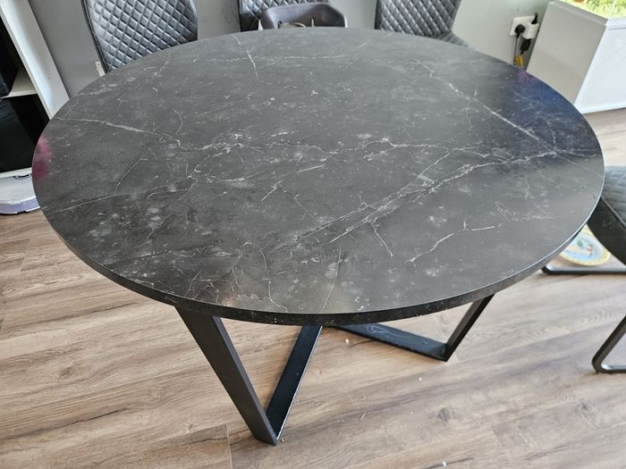 Round dining table with a matching coffee table