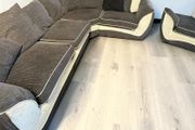 Dark grey corner sofa with matching armchair