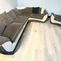 Dark grey corner sofa with matching armchair