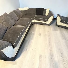Dark grey corner sofa with matching armchair