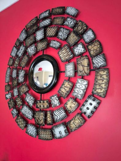 Metal wall art with mirror