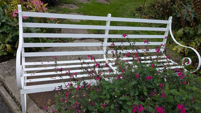 White metal garden bench