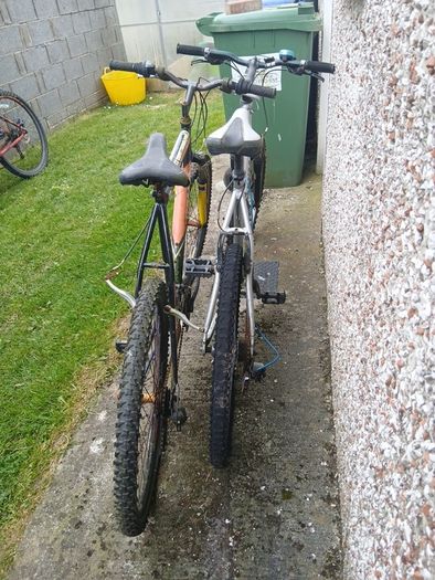 2 bikes silver one medium black one large