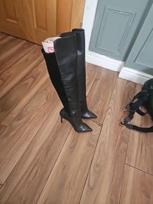 thigh high heeled leather boots