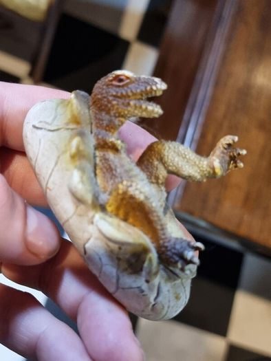 Hatching dinosaur toy figurine