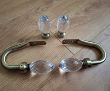Decorative pair of antique brass glass crystal curtain hold backs with matching finials