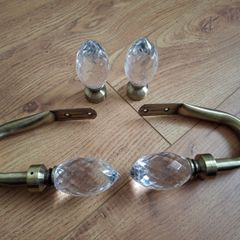 Decorative pair of antique brass glass crystal curtain hold backs with matching finials