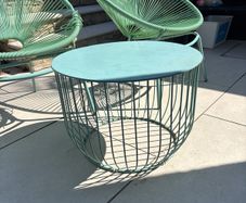 Marks & Spencer Lois garden furniture set in sage green, comprising two armchairs and a matching round table.