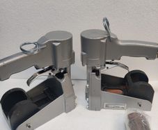 Top closing staplers with clamping anvils