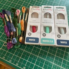Crochet hooks and embroidery thread