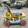 Wooden horse-themed ride-on toy in good used condition Image 4