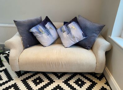 Cream 2 seater sofa
