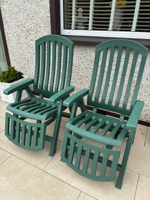 Two reclining sun loungers with cushions