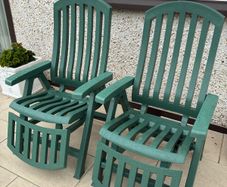 Two reclining sun loungers with cushions