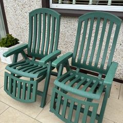 Two reclining sun loungers with cushions