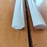 Two 2.4m lengths of white wooden moulding 10x10mm Image 5