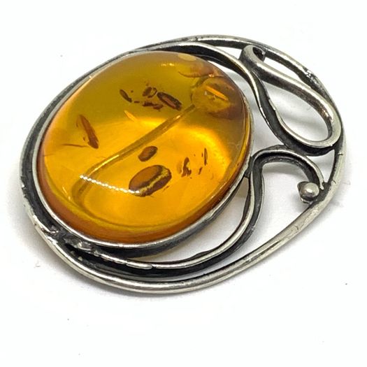 Art Nouveau silver brooch with Amber