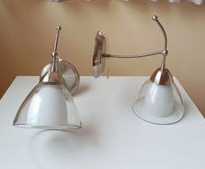 Endon matching wall sconce lights with a brushed stainless steel  finish and  clear glass shades and pull cord switch