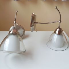 Endon matching wall sconce lights with a brushed stainless steel  finish and  clear glass shades and pull cord switch