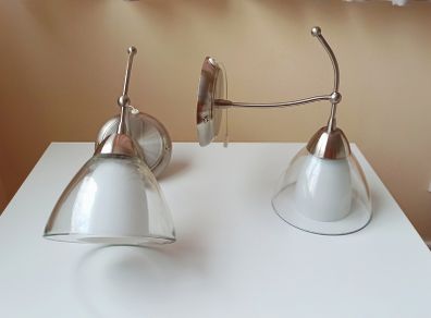 Endon matching wall sconce lights with a brushed stainless steel  finish and  clear glass shades and pull cord switch