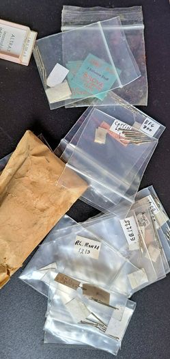Boxes of miscellaneous watch parts