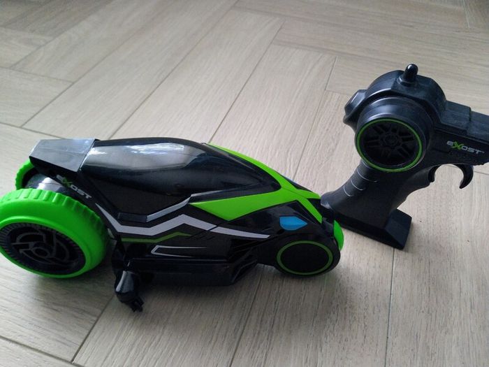 3 remote control vehicles & 1 blue racecar with lights & sounds