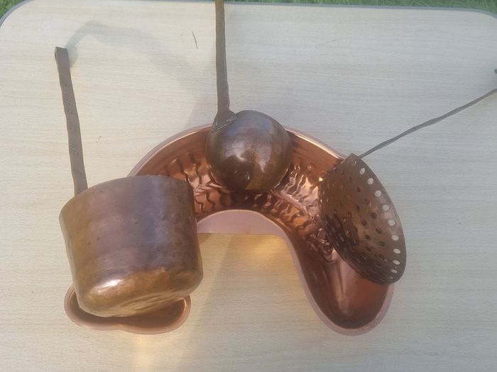 Vintage-style copper cookware and kitchen accessories.