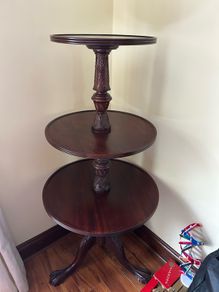 Three tier carved mahogany dumbwaiter