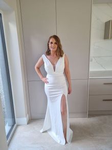 white full length v neck dress with side split
