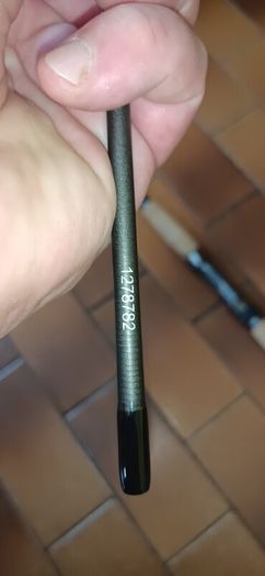 Shakespeare Agility Spin fishing rod. 11 feet (3.30 meters) in length. The item includes a black carrying tube with a strap for transport.