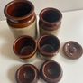 Selection of stoneware jars and condiment holders and Three little dishes added Image 3