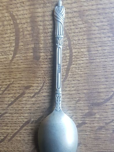 Vintage teaspoon with a saint on the handle