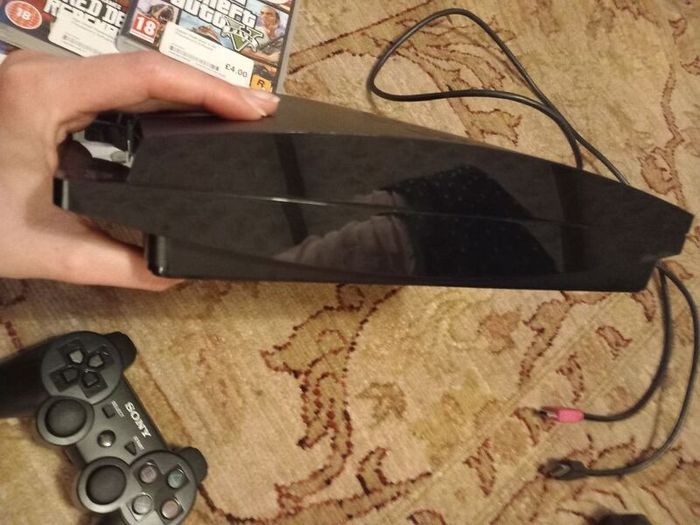 PS3 slim console, controller and games