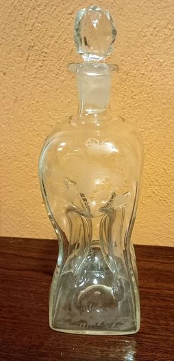 Antique hourglass shaped glass decanter