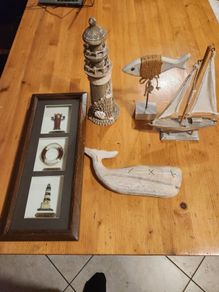 Nautical Themed Decorative Items x6 A Lighthouse And A Sailing Boat 2 Fish And A Windchimes. All In Good Condition.
